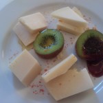 Cheese plate served with honey and marmalade