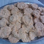 Tomatoes coated with flour, egg mixture, and breadcrumbs