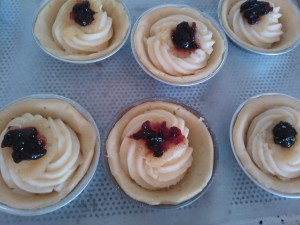 Individual Tarts with pastry cream, almond paste, and black cherry jam