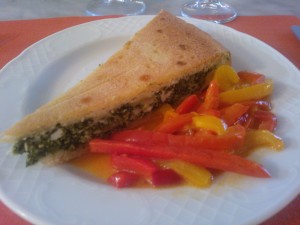 Spinach Pie served with a saute of mixed peppers