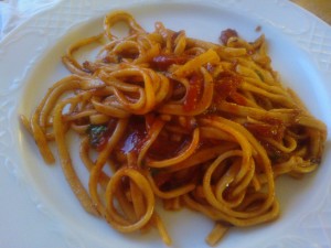 Octopus and tomato sauce served over spaghetti