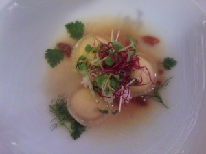 Handmade ravioli stuffed with mozzarella cheese scented with lemon and served in a sea urchin broth