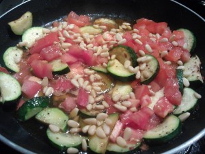 Sautéed zucchini and tomatoes with pine nuts