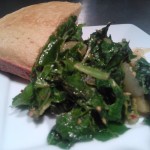 A side of sauteed turnip greens and wedge of cornbread
