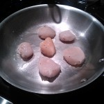 Searing the scallops in a touch of grapeseed oil