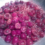 Cherries cooking in the reduced sauce, with a splash of brandy added