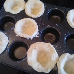 Pressing the pate brisee dough into the mini muffin pan