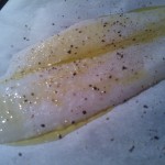 Sole filet seasoned and drizzled with olive oil