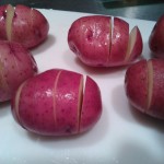 Baby red potatoes cut into accordion shapes