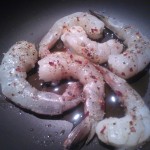 Sautéing the shrimp in olive oil