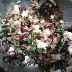 The mixture of brown rice, wild rice ,feta cheese, parsley and dried cranberries