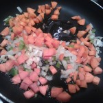 Sautéing the carrots, onion and celery in olive oil
