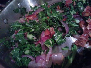 Sautéing the red onion, collard greens & bacon