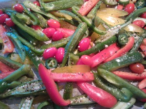 Okra, peppers, cherry tomatoes and jalapenos ready to be roasted