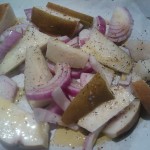 The prepared pears and red onion slices, ready to be roasted