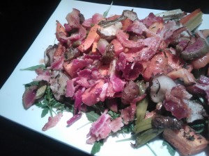 Roasted sunchokes, radishes & carrots with bacon, served over arugula