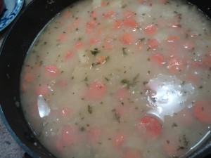 The thickened sauce studded with the cooked vegetables