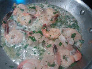 Cooking the shrimp with garlic, fennel seeds and clam juice
