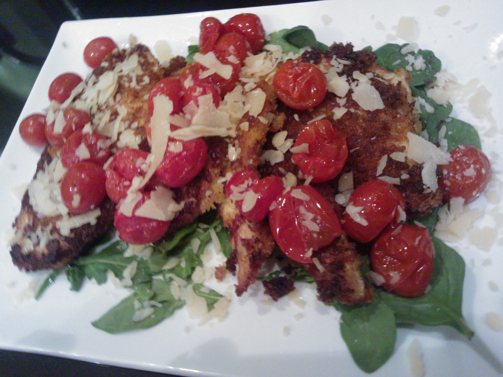 Chicken Milanese topped with roasted cherry tomatoes 
