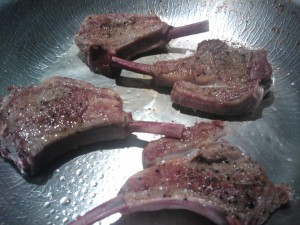 Searing the seasoned lamb chops