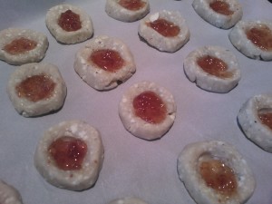 The rounds of dough topped with fig jam and ready to be baked