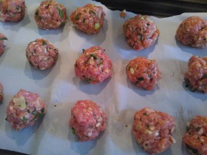 The meatballs formed and ready to be baked