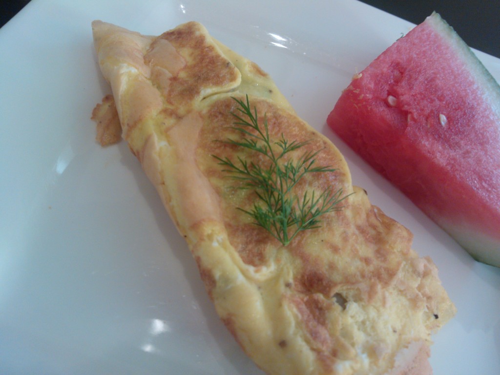 The simple omelette served with a fresh wedge of watermelon