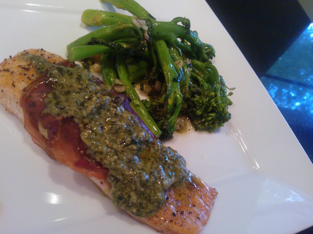 The baked salmon served with a side of lemony broccolini