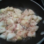 Caramelizing the cubed, cinnamon-sugar apples in butter